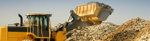 Loader Tipping Rocks in a Quarry